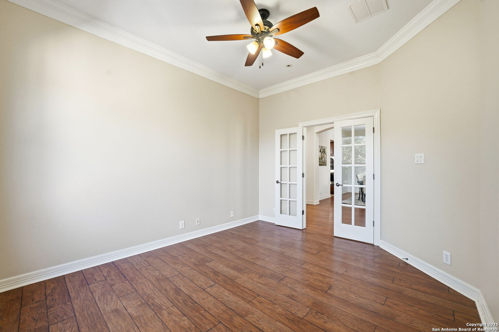 410 Heather Ridge San Antonio, TX 78260 - Photo 19 of 43 wooden floor in an empty room with a window
