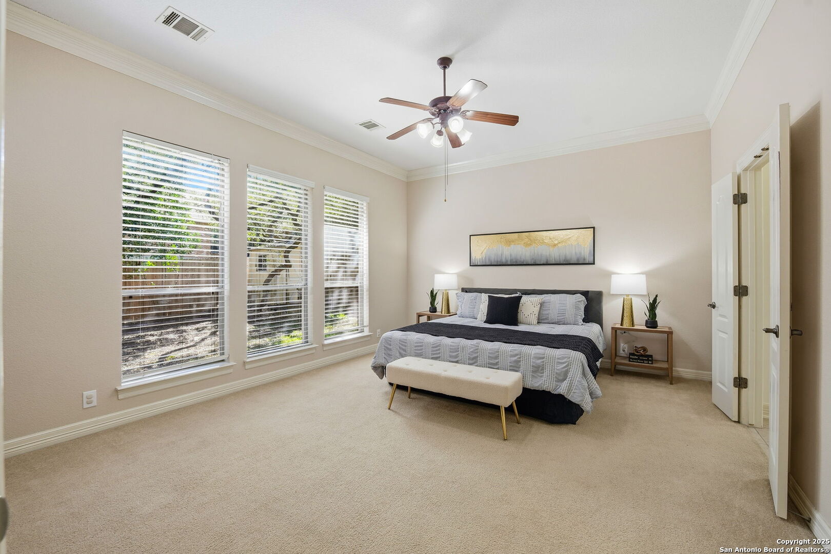 410 Heather Ridge San Antonio, TX 78260 - Photo 20 of 43 a bed room with a bed and a chandelier