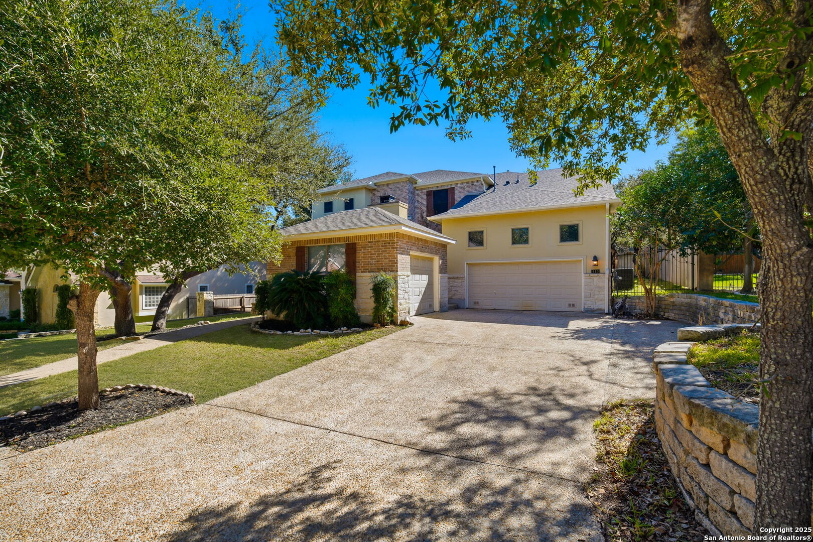 410 Heather Ridge San Antonio, TX 78260 - Photo 2 of 43 a front view of a house with a yard and garage