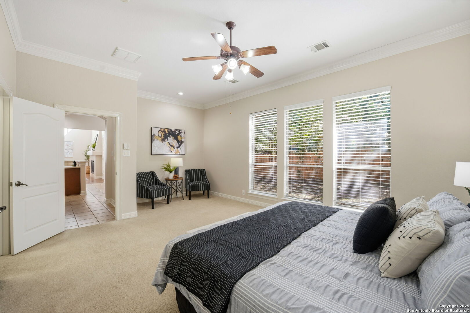 410 Heather Ridge San Antonio, TX 78260 - Photo 21 of 43 a bedroom with a large bed and a large window