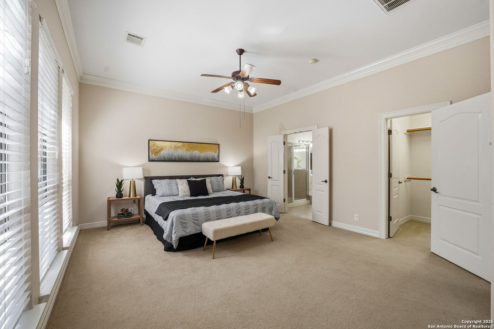 410 Heather Ridge San Antonio, TX 78260 - Photo 23 of 43 a spacious bedroom with a bed and a chandelier
