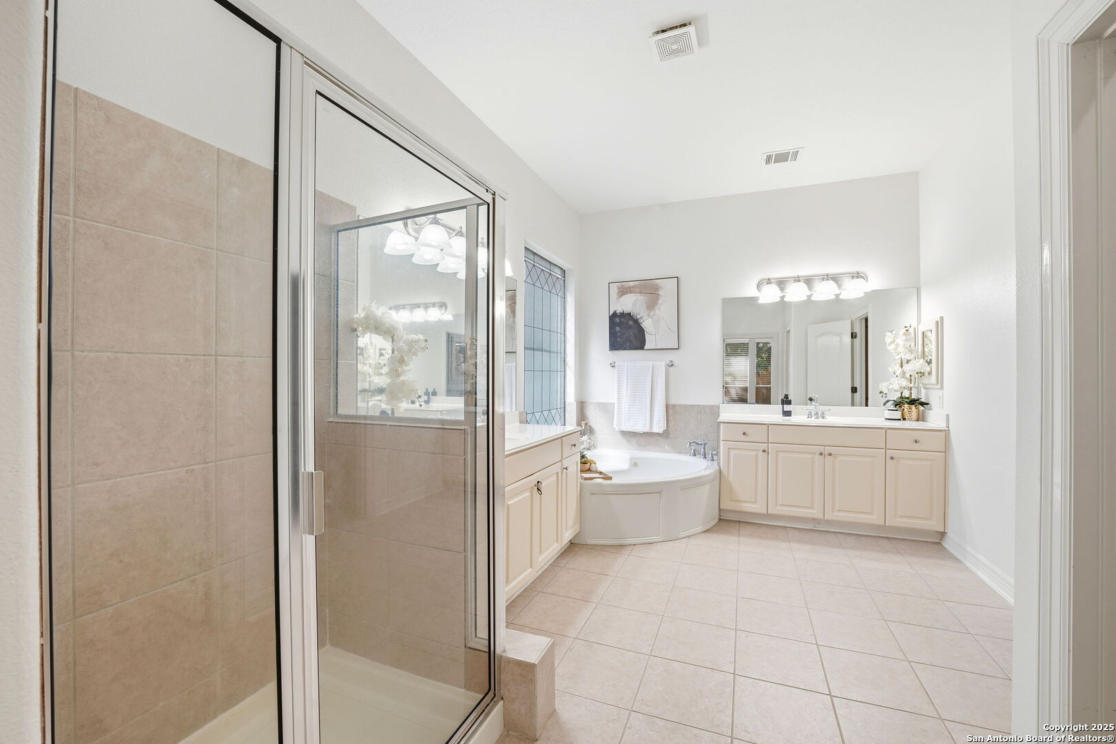 410 Heather Ridge San Antonio, TX 78260 - Photo 24 of 43 a bathroom with a double vanity sink a toilet a mirror and shower