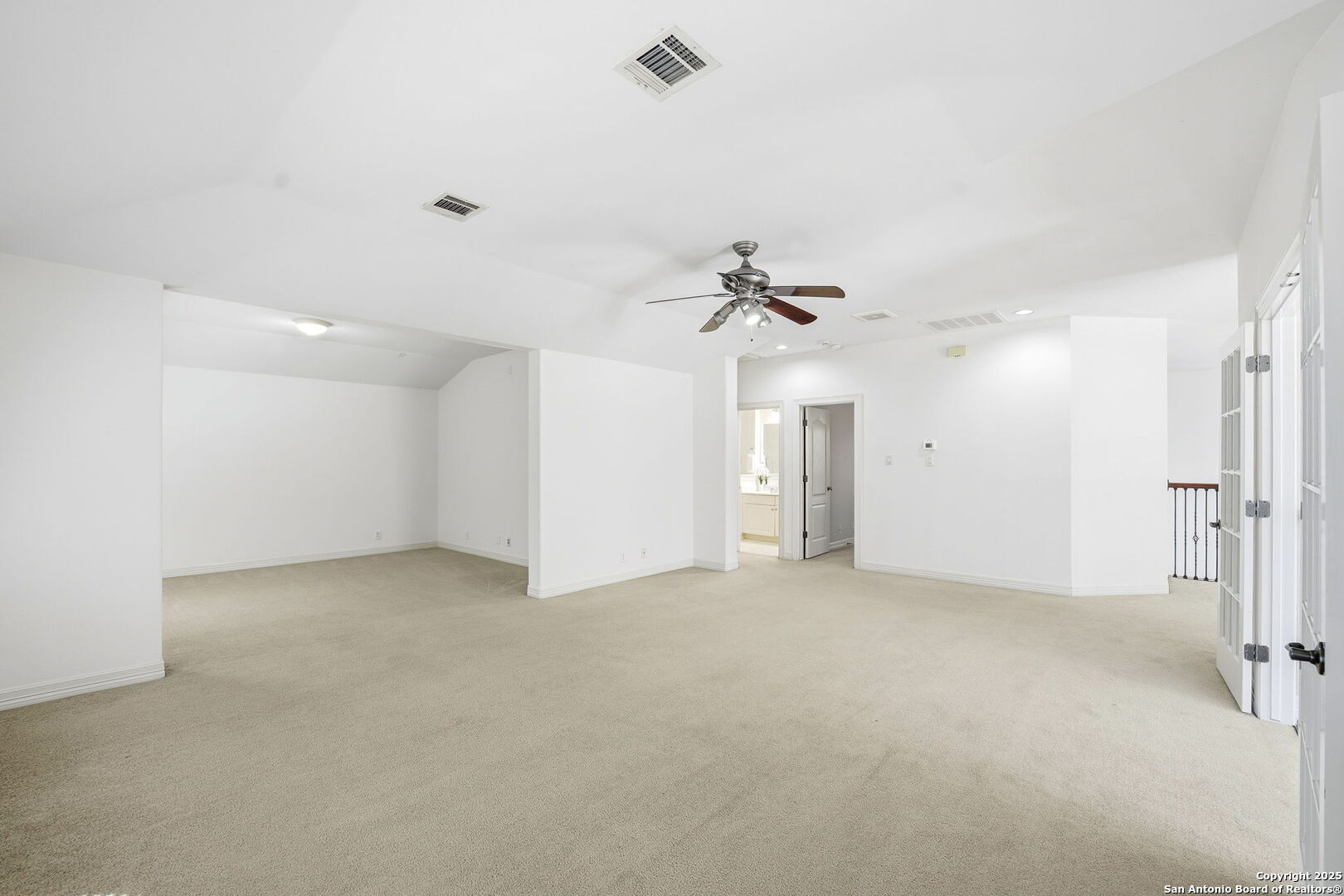 410 Heather Ridge San Antonio, TX 78260 - Photo 29 of 43 an empty room with a ceiling fan and a bathroom