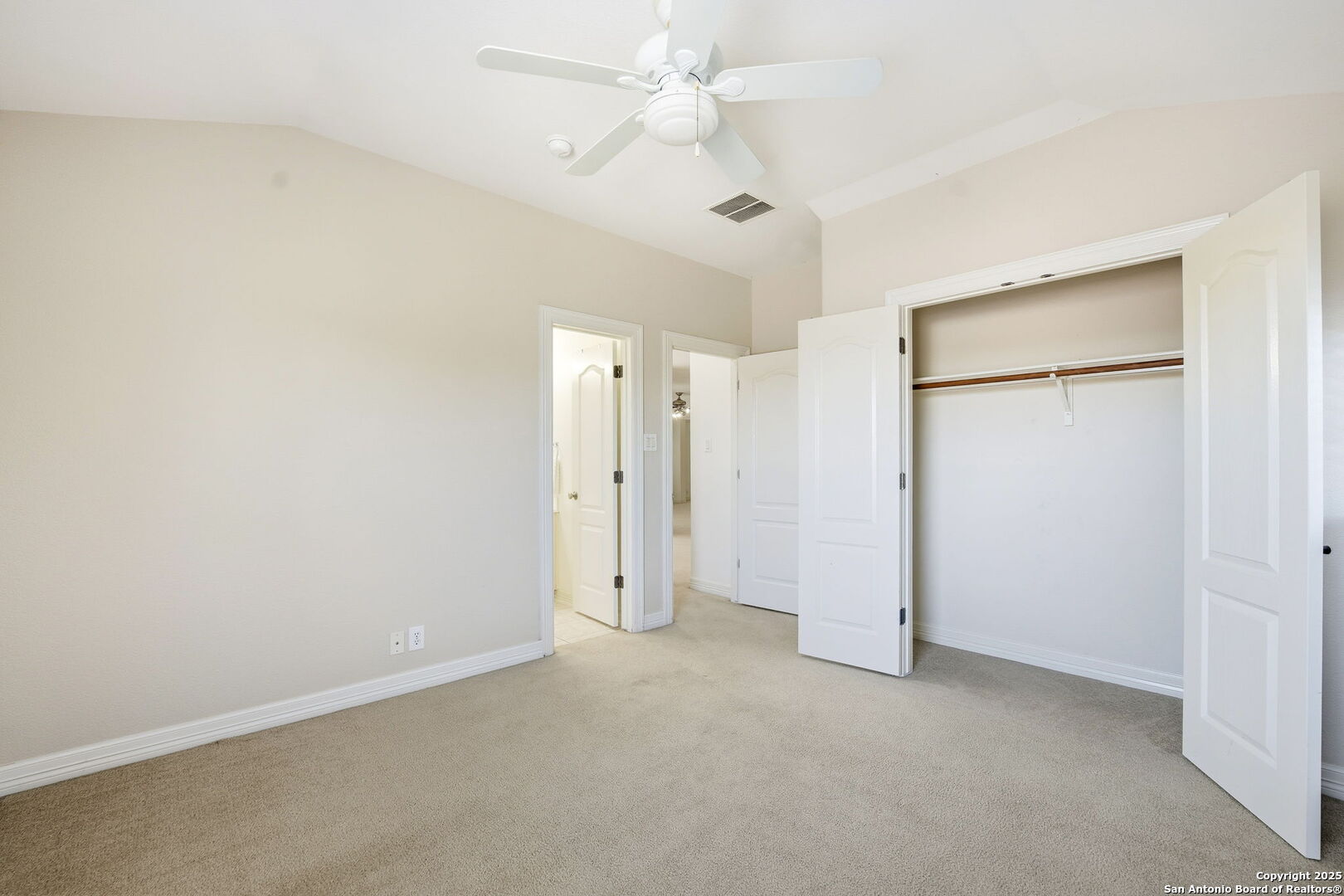 410 Heather Ridge San Antonio, TX 78260 - Photo 32 of 43 an empty room with closet and a ceiling fan