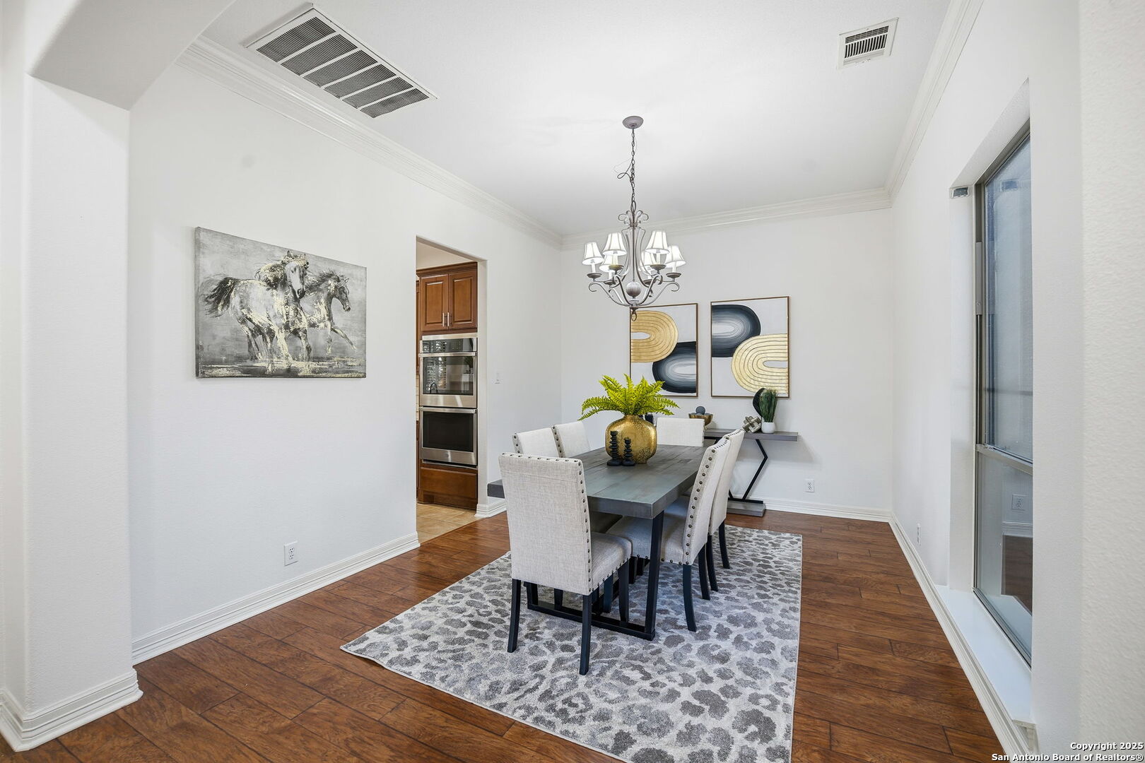 410 Heather Ridge San Antonio, TX 78260 - Photo 7 of 43 a dining room with furniture a rug and wooden floor