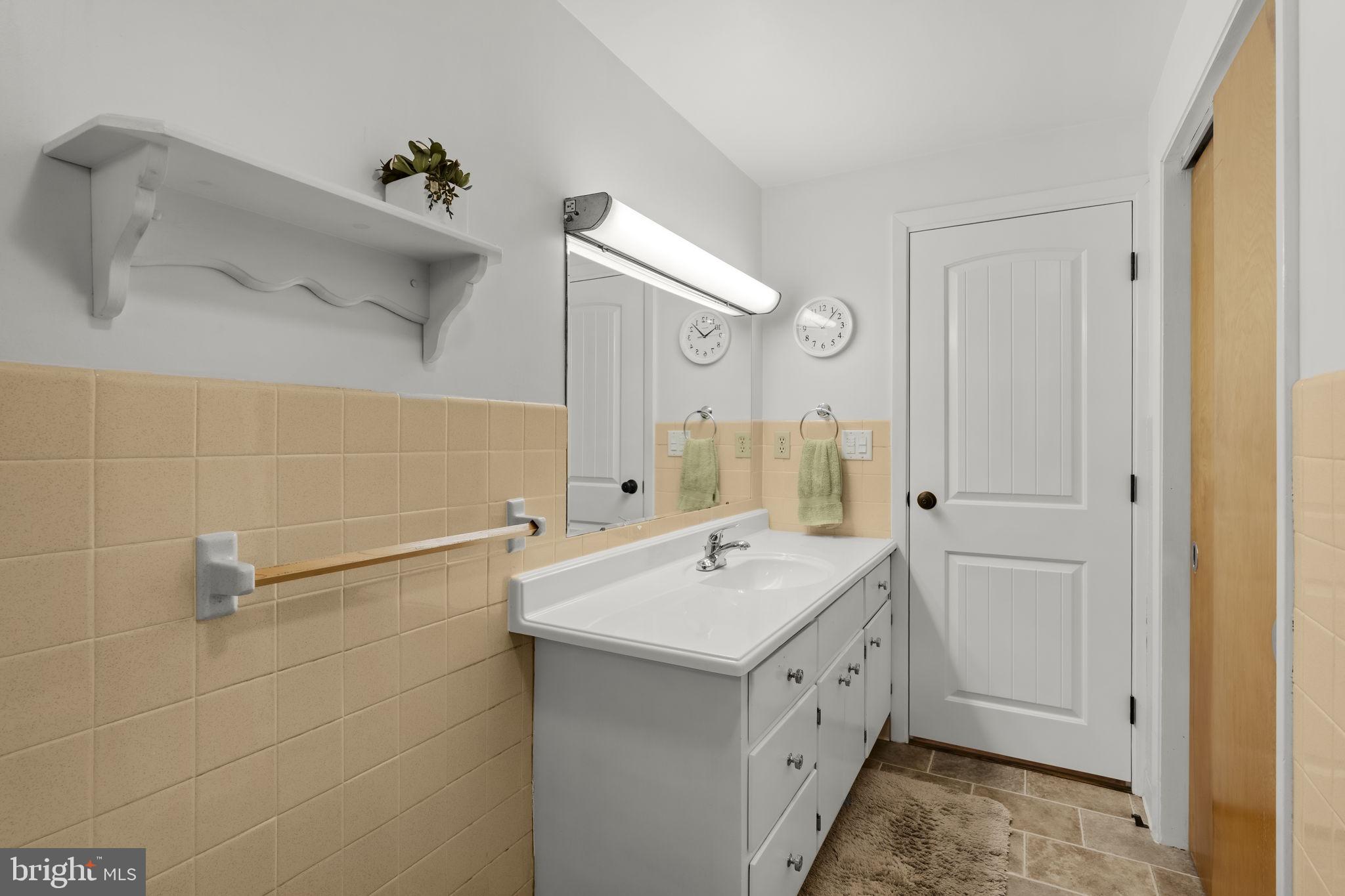 1160 Narvon Road Narvon, PA 17555 - Photo 44 of 64 a spacious bathroom with a double vanity sink a mirror and a bathtub