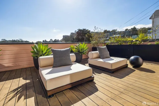 a bathroom with a granite countertop sink a toilet and mirror