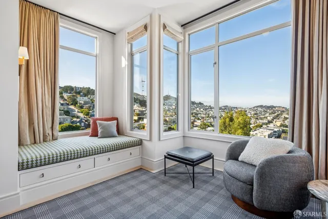 a kitchen with a refrigerator and cabinets