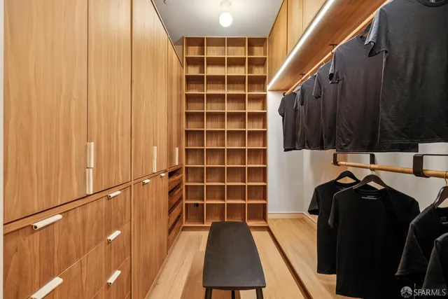 a view of roof deck with seating space and potted plants