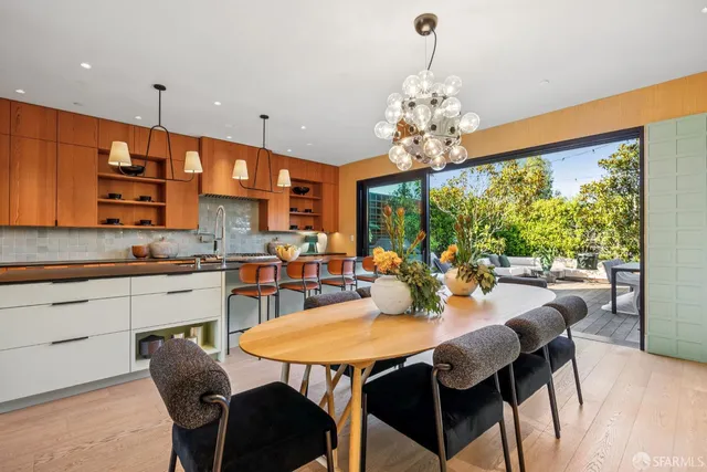 a view of a dining room with furniture window and outside view