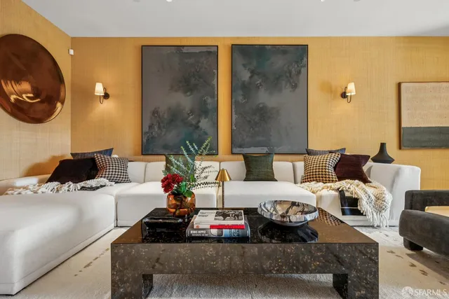 a balcony with furniture and a garden