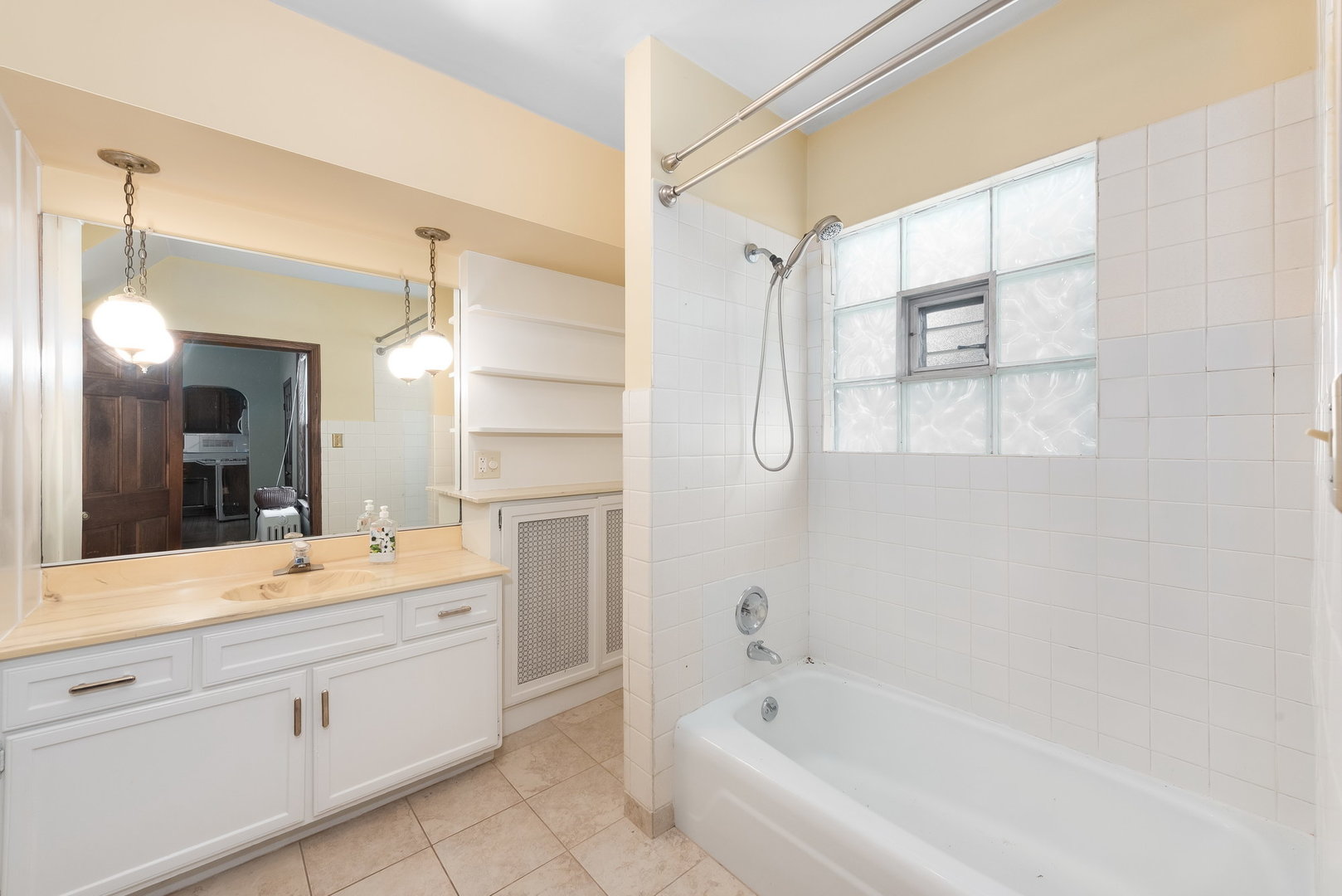 318 West Wing Street Arlington Heights, IL 60005 - Photo 11 of 16 a bathroom with a double vanity sink mirror and bathtub