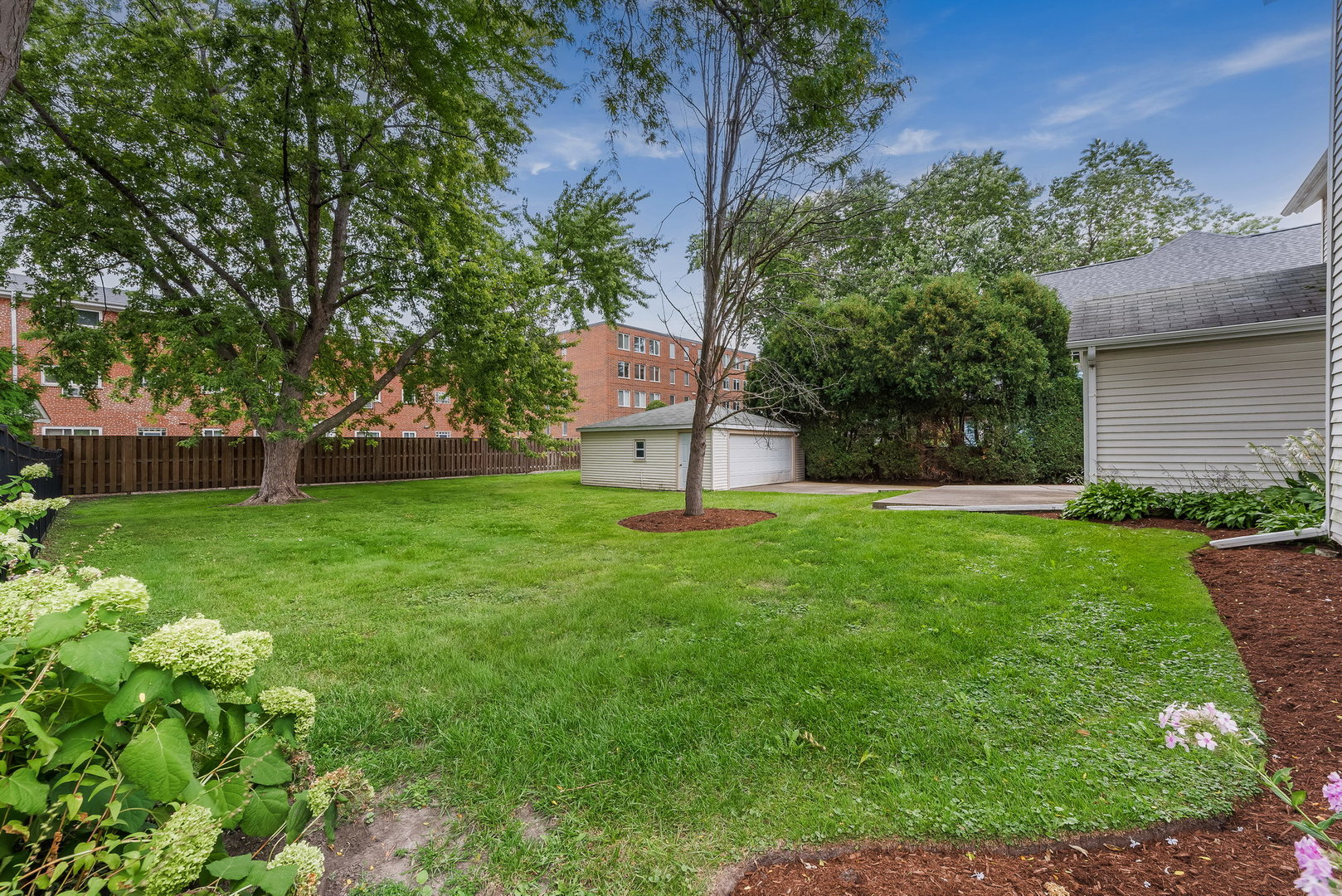 318 West Wing Street Arlington Heights, IL 60005 - Photo 16 of 16 a view of a house with a yard and a large tree