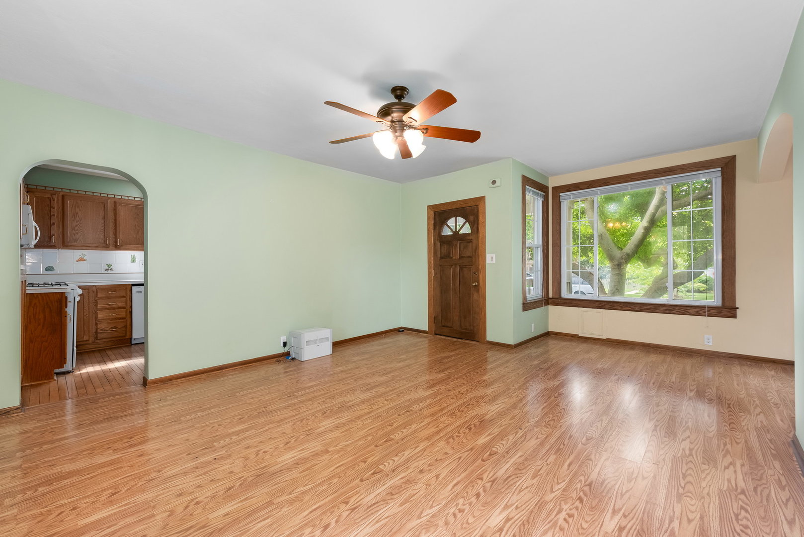 318 West Wing Street Arlington Heights, IL 60005 - Photo 4 of 16 wooden floor in an empty room with a window