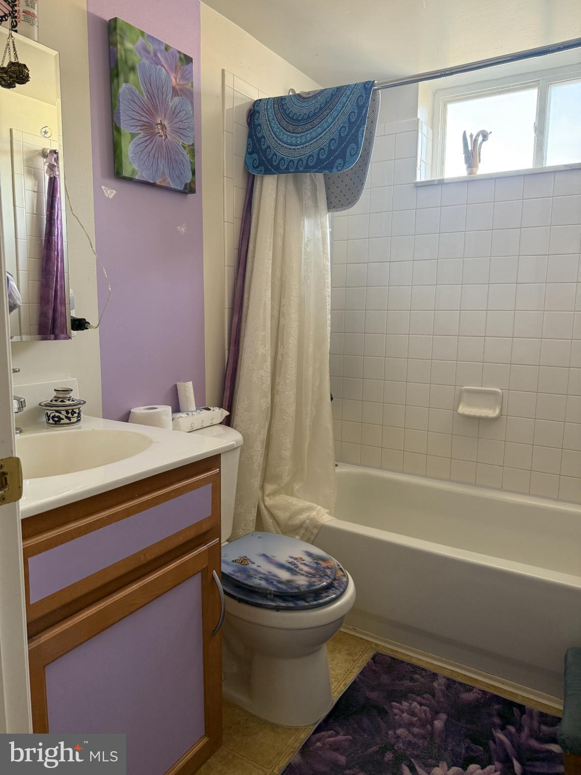 5000 Call Place Southeast, Unit 303 Washington, DC 20019 - Photo 14 of 16 Charming bathroom with vibrant accents.