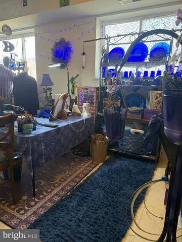 a room with wooden floor and a fireplace