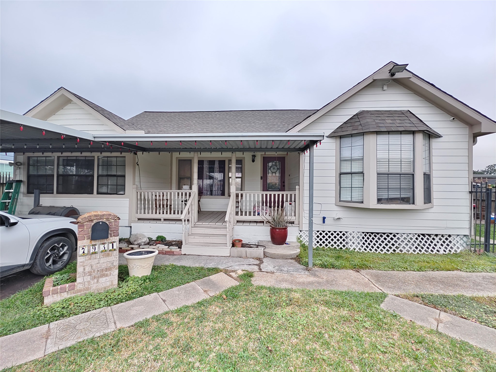 7931 Scanlock Street Houston, TX 77012 - Photo 1 of 28 a front view of a house with a yard