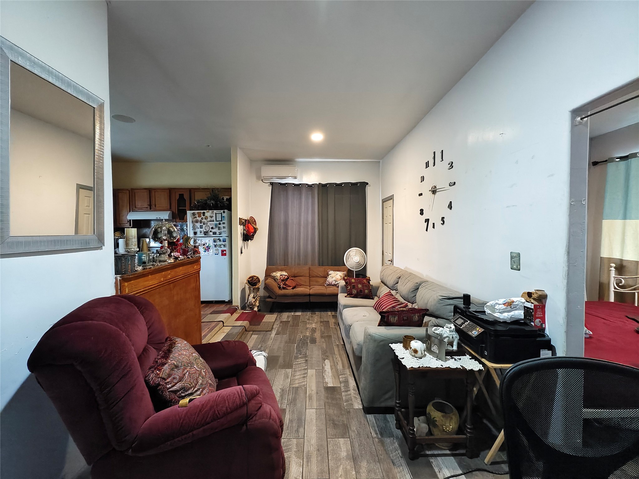 7931 Scanlock Street Houston, TX 77012 - Photo 19 of 28 a living room with furniture and wooden floor