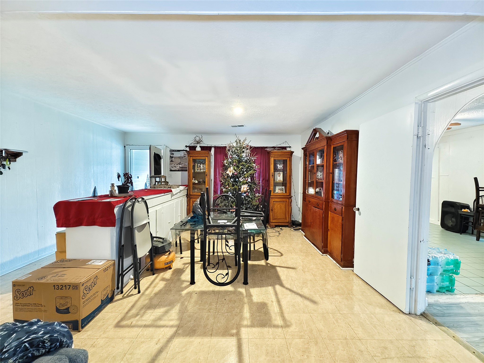 7931 Scanlock Street Houston, TX 77012 - Photo 5 of 28 a view of a room with lots of furniture and gym equipment