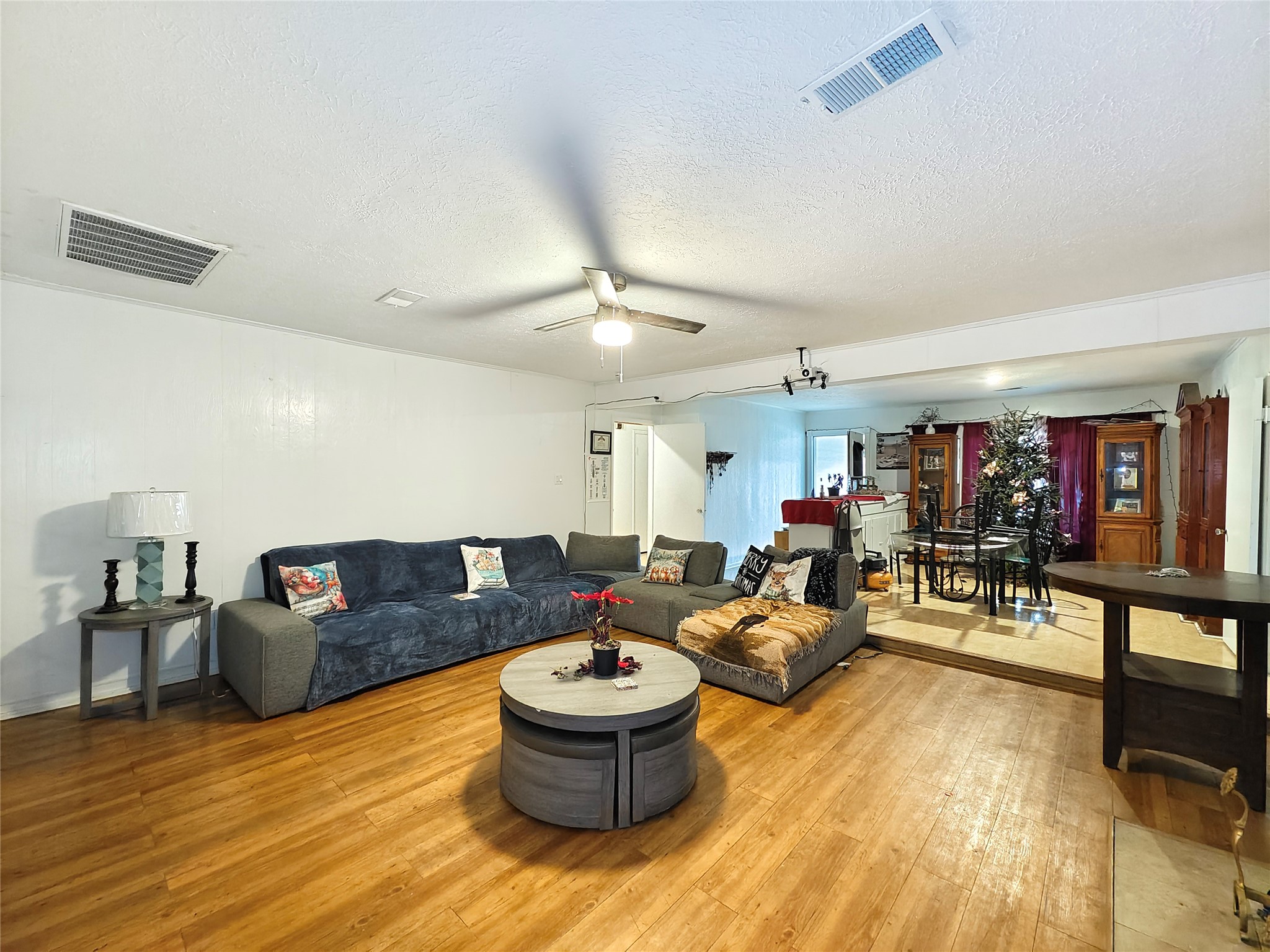 7931 Scanlock Street Houston, TX 77012 - Photo 6 of 28 a living room with furniture and wooden floor