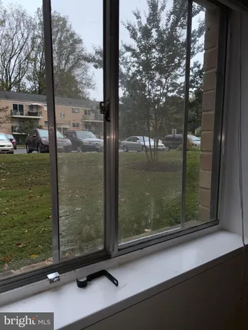 a view of a window and a tree