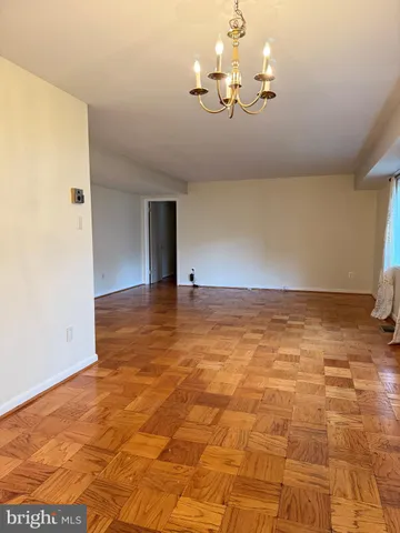 a view of a livingroom with wooden floor