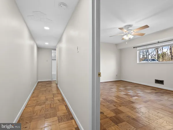 a view of livingroom with hardwood floor and a ceiling fan
