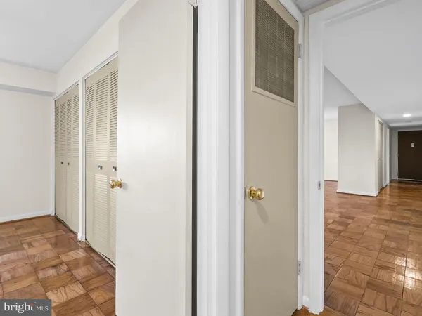 a view of a bathroom from a hallway