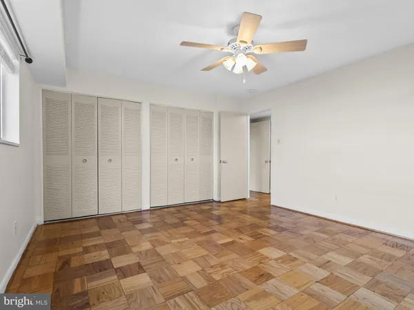 a view of a room with a ceiling fan