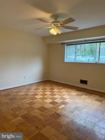 a view of an empty room with a window