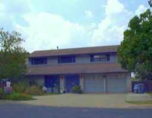 6908 Bill Hughes Road Austin, TX 78745 - Photo 1 of 1 a red brick building with trees in front of it