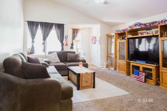 315 Henry Street Ridgecrest, CA 93555 - Photo 7 of 27 a living room with furniture and a flat screen tv