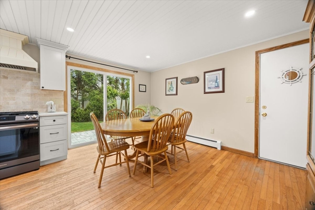 34 Windsor Way Mashpee, MA 02649 - Photo 17 of 42 a view of a dining room with furniture window and wooden floor