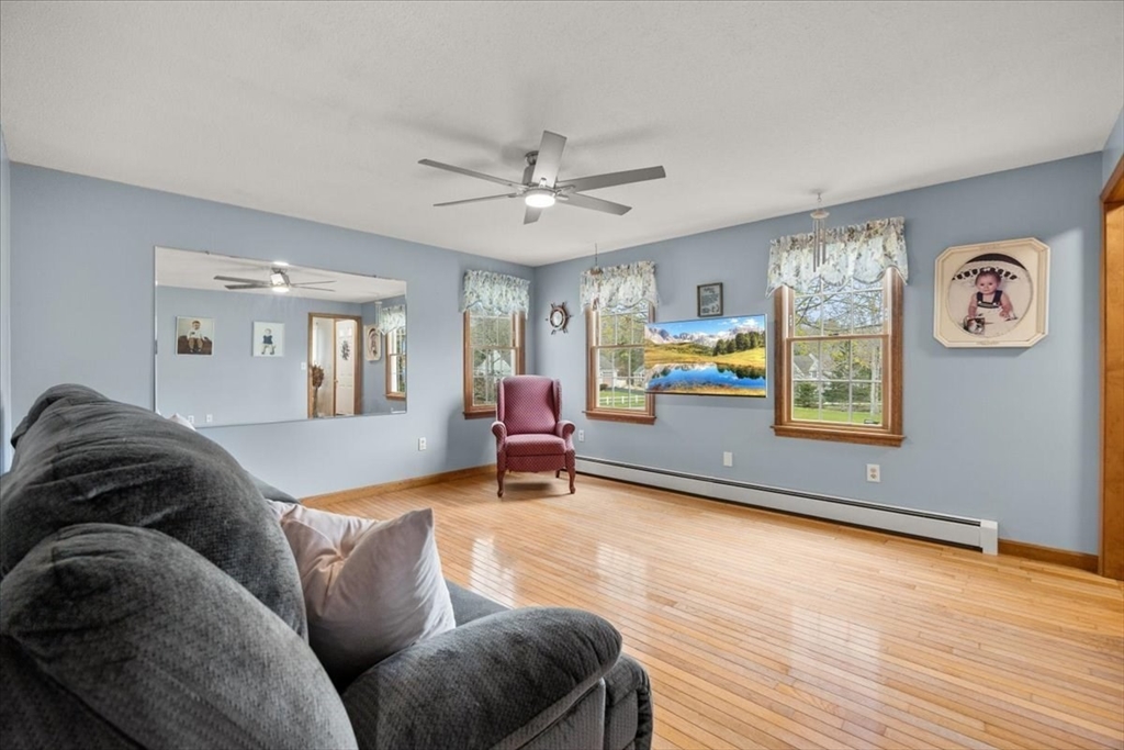 34 Windsor Way Mashpee, MA 02649 - Photo 23 of 42 a living room with furniture and a flat screen tv