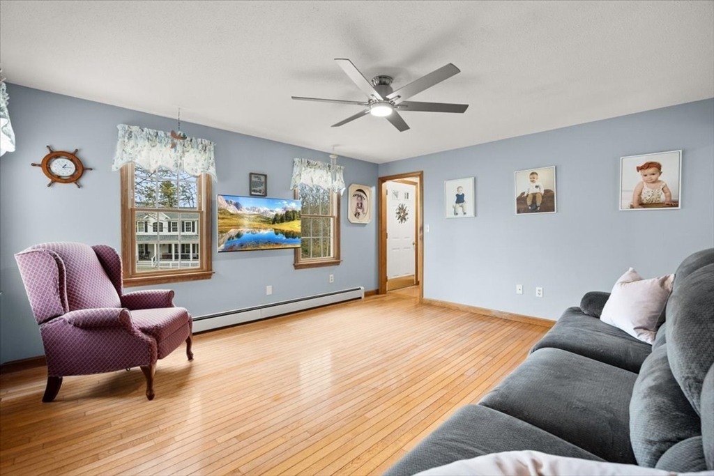 34 Windsor Way Mashpee, MA 02649 - Photo 24 of 42 a living room with furniture and a window