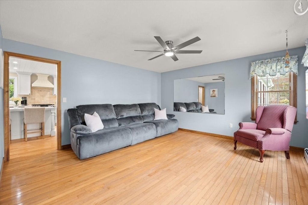 34 Windsor Way Mashpee, MA 02649 - Photo 25 of 42 a living room with furniture and a wooden floor