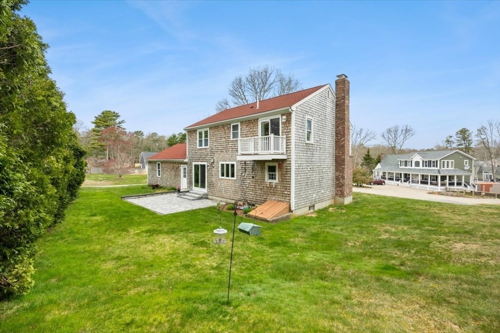 34 Windsor Way Mashpee, MA 02649 - Photo 7 of 42 a front view of house with yard and seating area