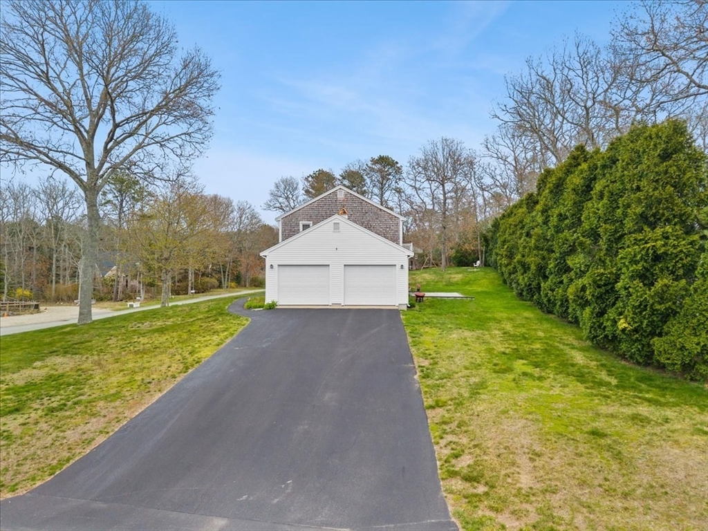 34 Windsor Way Mashpee, MA 02649 - Photo 8 of 42 a view of a house with garden