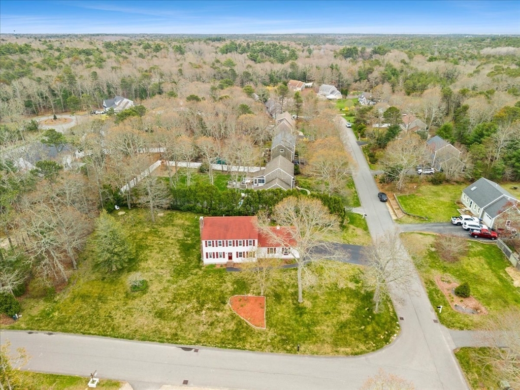 34 Windsor Way Mashpee, MA 02649 - Photo 9 of 42 an aerial view of residential houses with outdoor space