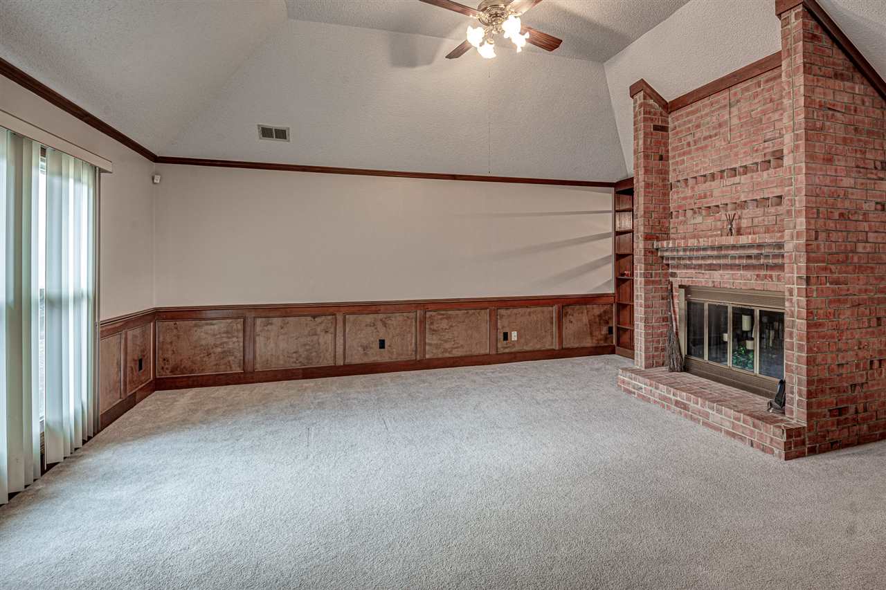 8516 Bazemore Road Memphis, TN 38018 - Photo 4 of 21 Main living space with feature brick fireplace.