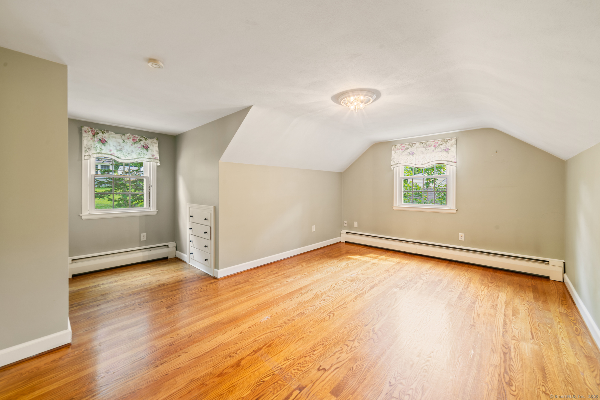 80 Dryden Drive Meriden, CT 06450 - Photo 16 of 23 an empty room with wooden floor and windows