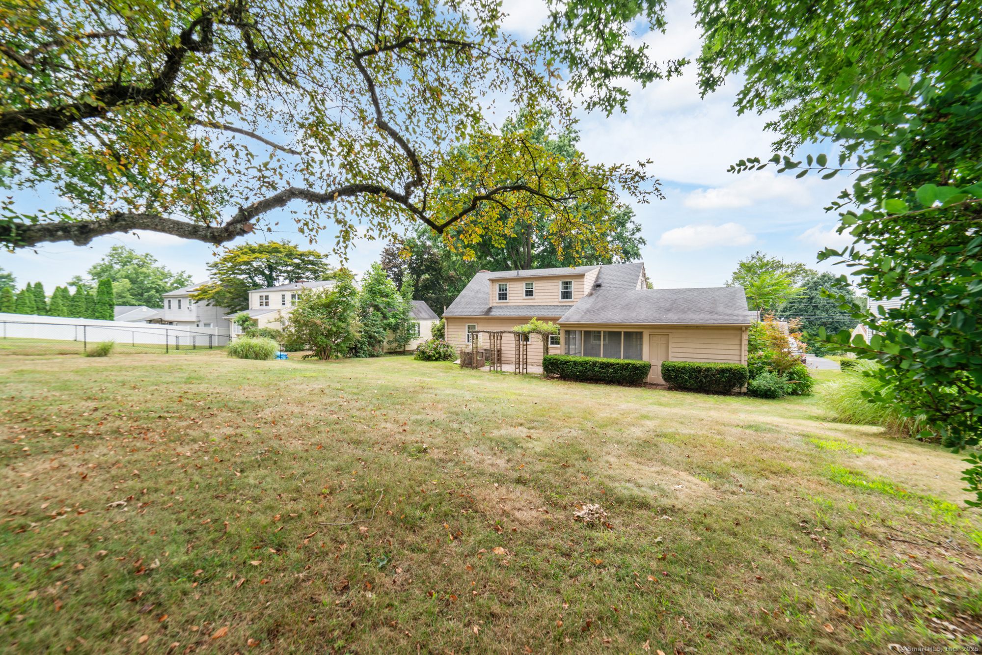 80 Dryden Drive Meriden, CT 06450 - Photo 22 of 23 a front view of a house with a garden and yard