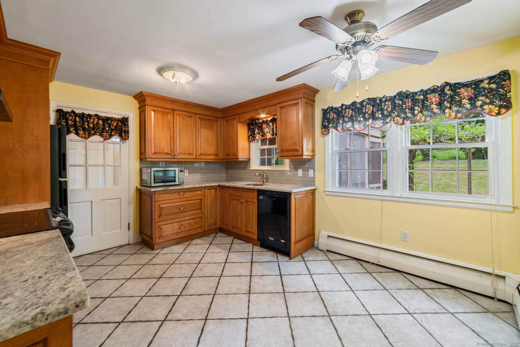 80 Dryden Drive Meriden, CT 06450 - Photo 4 of 23 a kitchen with stainless steel appliances granite countertop a stove a sink and a refrigerator