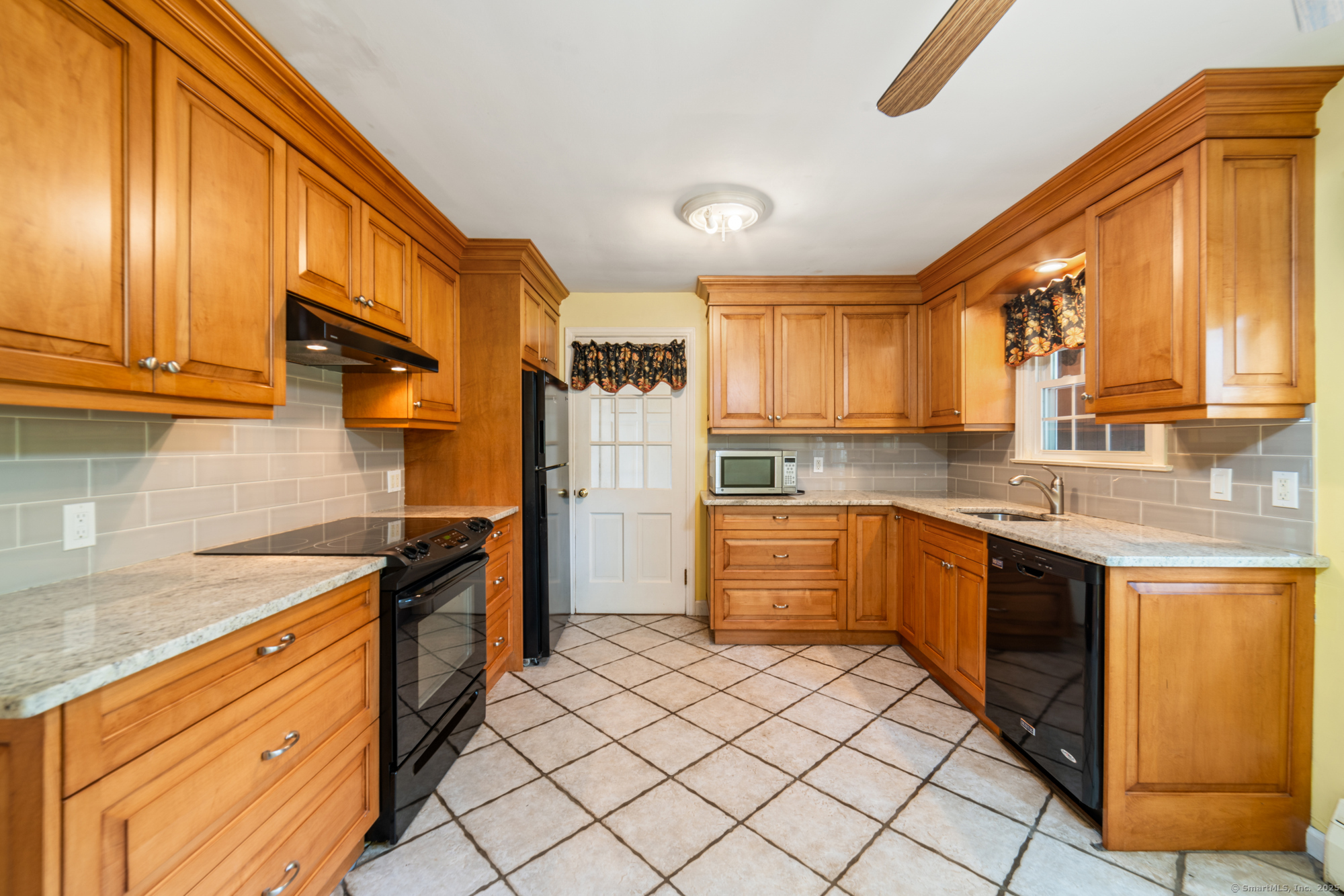 80 Dryden Drive Meriden, CT 06450 - Photo 5 of 23 a kitchen with stainless steel appliances granite countertop a sink and cabinets