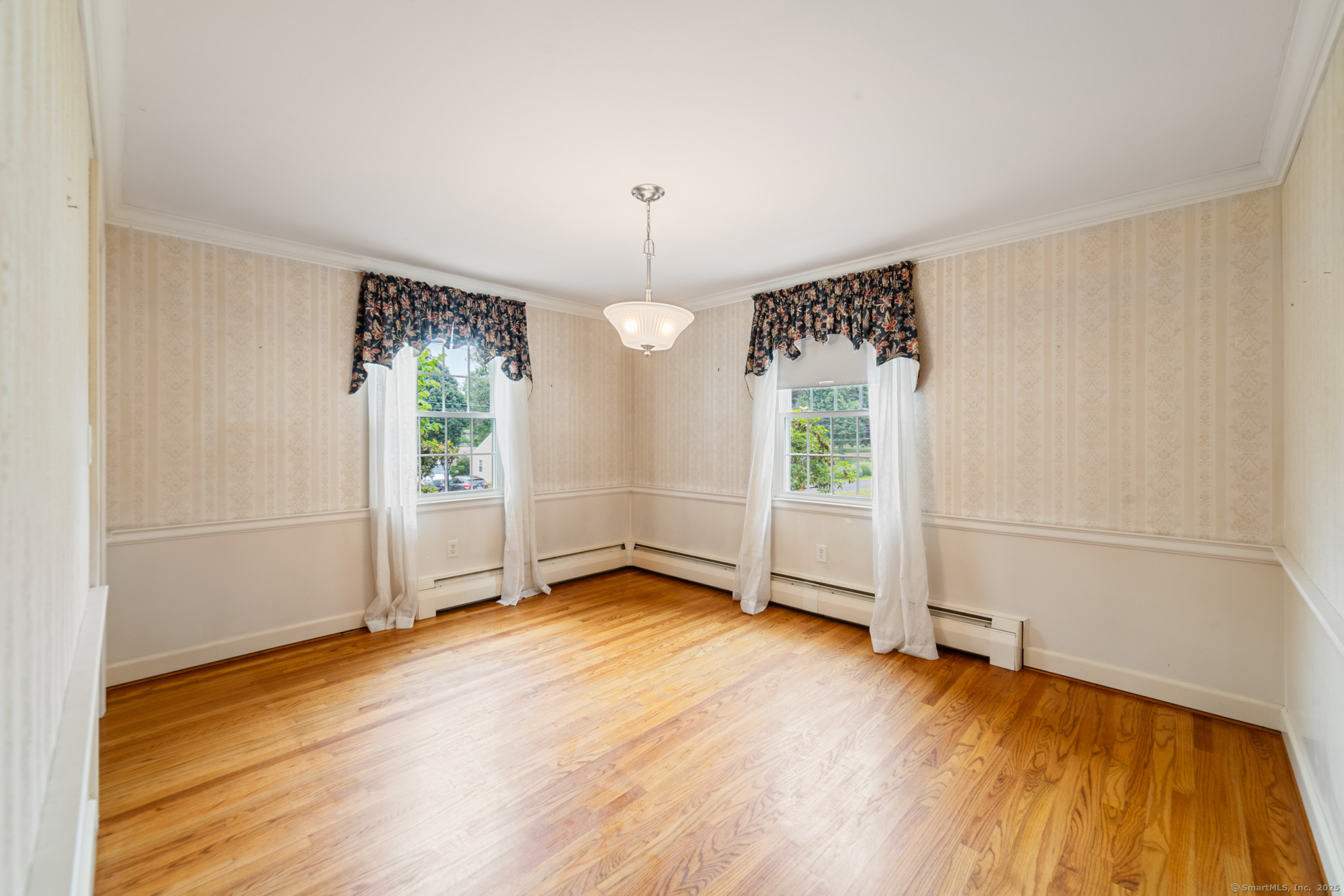 80 Dryden Drive Meriden, CT 06450 - Photo 6 of 23 an empty room with wooden floor mirror and windows