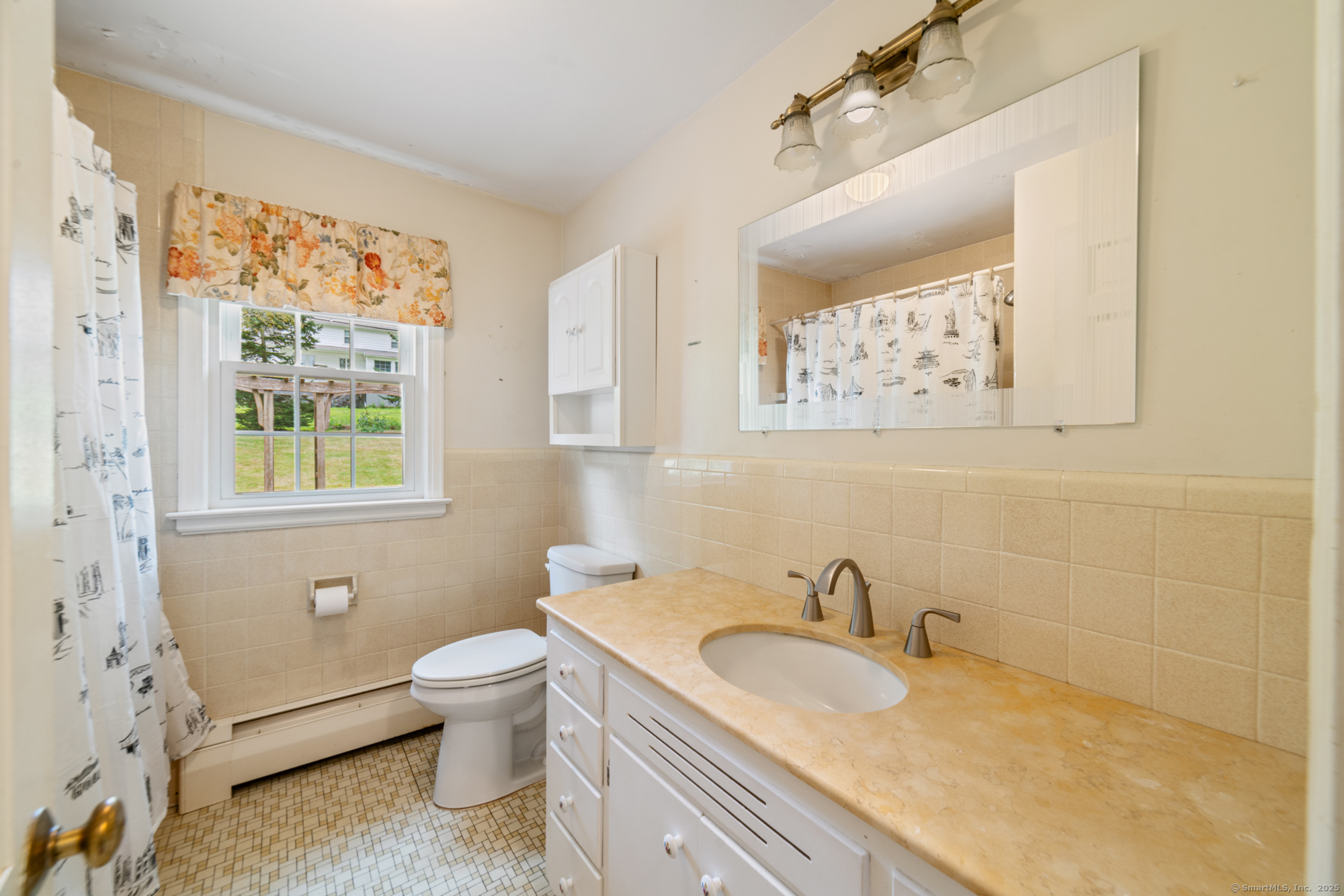 80 Dryden Drive Meriden, CT 06450 - Photo 10 of 23 a bathroom with a granite countertop sink a toilet and a window