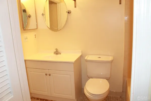 a bathroom with a toilet and a sink