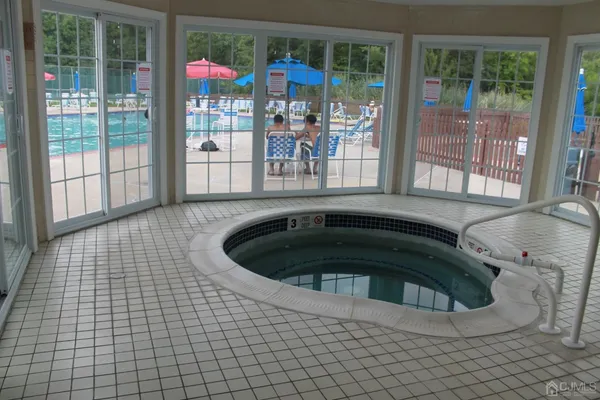 a view of swimming pool and outdoor seating