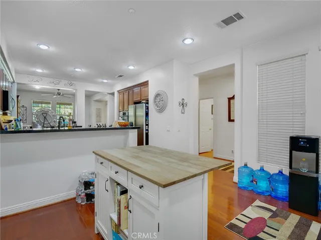 a view of kitchen with cabinets and wooden floor