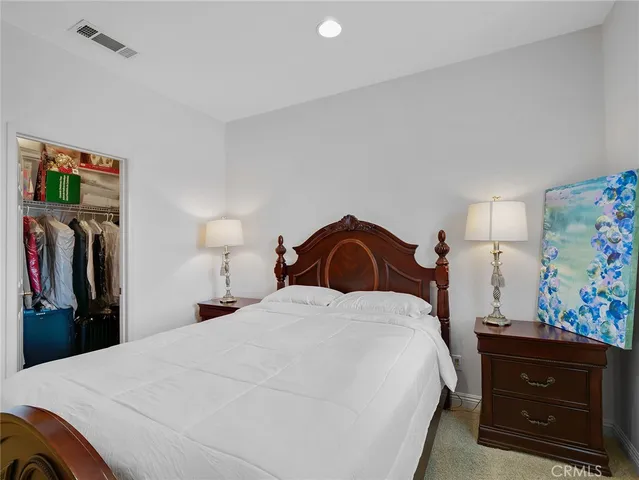 a bed room with a bed and a television